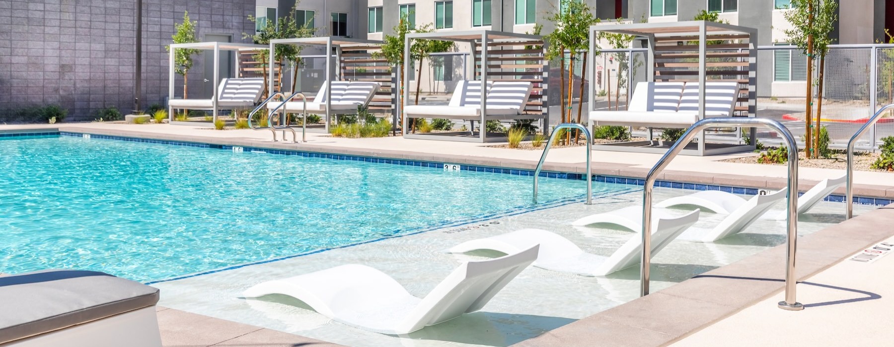 a swimming pool in front of a building