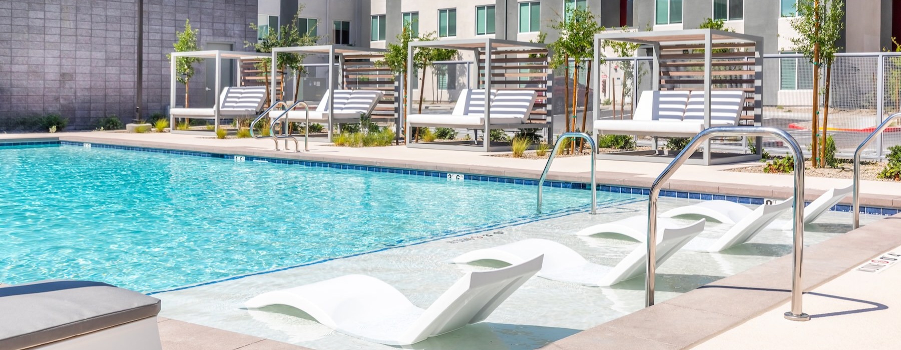 a swimming pool in front of a building