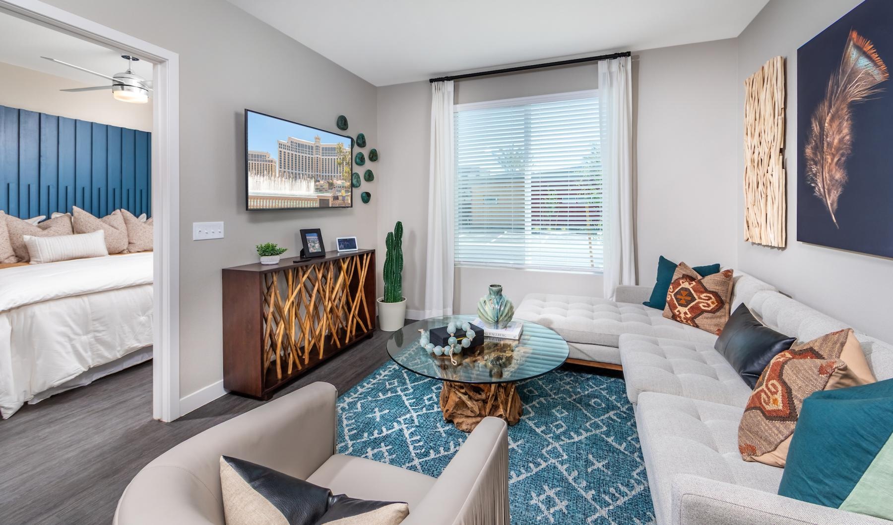 a living room with a couch coffee table and area rug