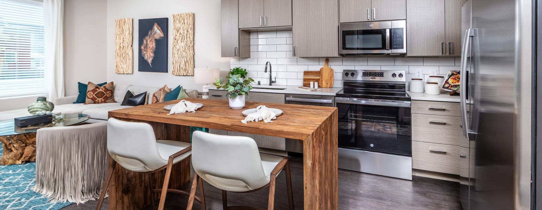 a kitchen with a table and chairs